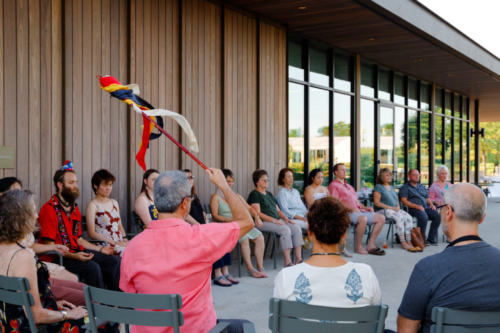 Alejandro Chaoul leads a group meditation session at the Summer Soulstice Dinner. (Photo by Liz Silva)