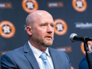 Houston Astros outfielder Yordan Alvarez, flanked by Astros general Manager James Click and a Spanish translator, announced a 6-year, $115 million contract extension that keeps the young Cuban slugger an Astro through 2028, at a Minute Maid Park news conf