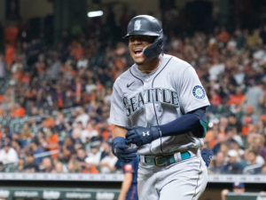 Houston Astros outfielder Yordan Alvarez, flanked by Astros general Manager James Click and a Spanish translator, announced a 6-year, $115 million contract extension that keeps the young Cuban slugger an Astro through 2028, at a Minute Maid Park news conf