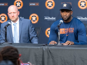 Houston Astros outfielder Yordan Alvarez, flanked by Astros general Manager James Click and a Spanish translator, announced a 6-year, $115 million contract extension that keeps the young Cuban slugger an Astro through 2028, at a Minute Maid Park news conf