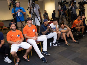 Houston Astros outfielder Yordan Alvarez, flanked by Astros general Manager James Click and a Spanish translator, announced a 6-year, $115 million contract extension that keeps the young Cuban slugger an Astro through 2028, at a Minute Maid Park news conf