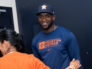 Houston Astros outfielder Yordan Alvarez, flanked by Astros general Manager James Click and a Spanish translator, announced a 6-year, $115 million contract extension that keeps the young Cuban slugger an Astro through 2028, at a Minute Maid Park news conf
