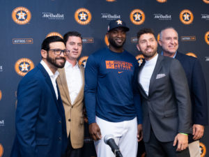 Houston Astros outfielder Yordan Alvarez, flanked by Astros general Manager James Click and a Spanish translator, announced a 6-year, $115 million contract extension that keeps the young Cuban slugger an Astro through 2028, at a Minute Maid Park news conf