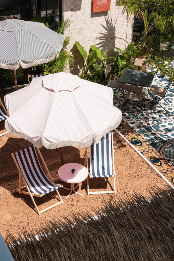 Bishop Lane includes sand, beach chairs, and umbrellas to relax. (Courtesy of Exxir Hospitality)