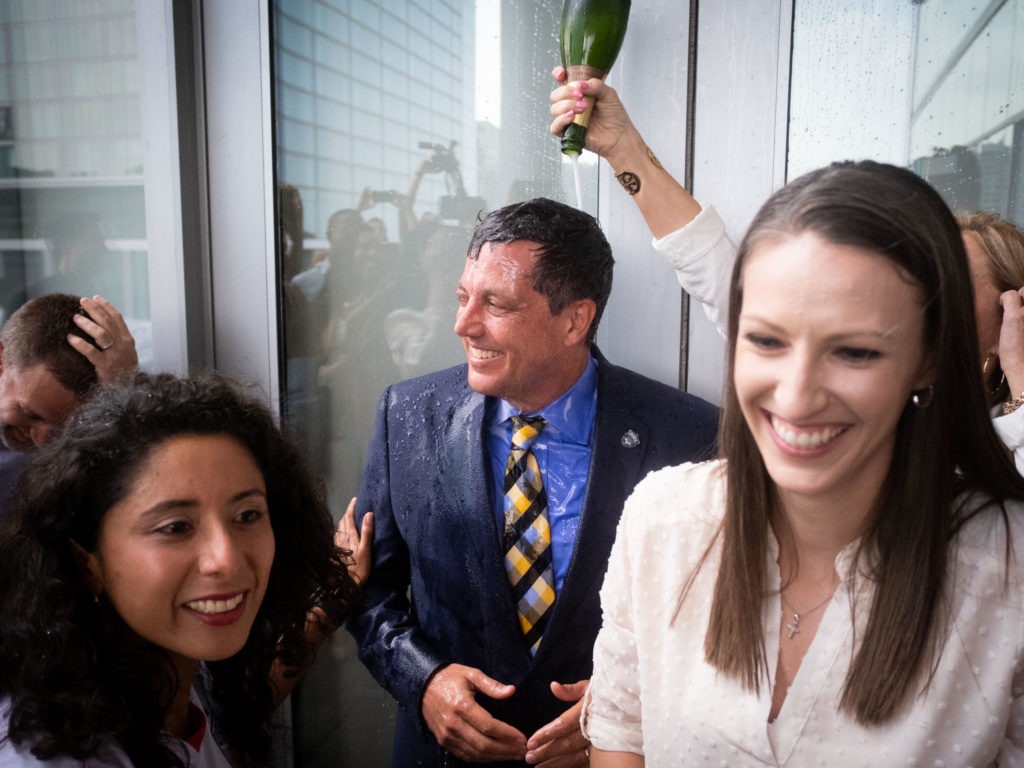 Houston 2026 World Cup Bid Committee president Chris Canetti received a joyous champagne dousing for all his hard work.  (Photo F. Carter Smith)