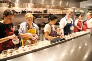 IHWSH members prepare a foodie/music/art benefit for reproductive rights. (Photo by Emily Jaschke)