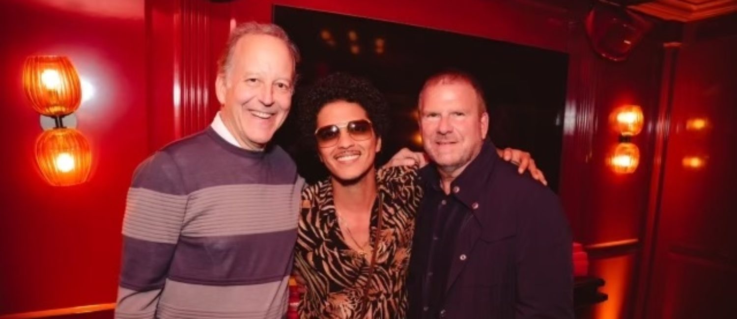 Sportscaster/author Jim Gray, Bruno Mars, Tilman Fertitta at the opening of Catch Steak in West Hollywood.