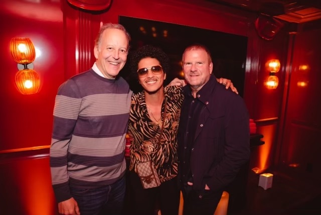 Sportscaster/author Jim Gray, Bruno Mars, Tilman Fertitta at the opening of Catch Steak in West Hollywood.