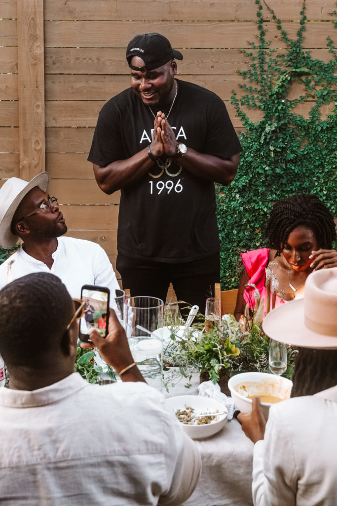 Courtney Lindsay, Devon Fanfair, Chef Ope Amosu, Danielle Fanfair and Chasitie Lindsay break bread together at ChòpnBlok as Amosu shares the inspiration behind his innovative West African menu. (Photo by William Issac)