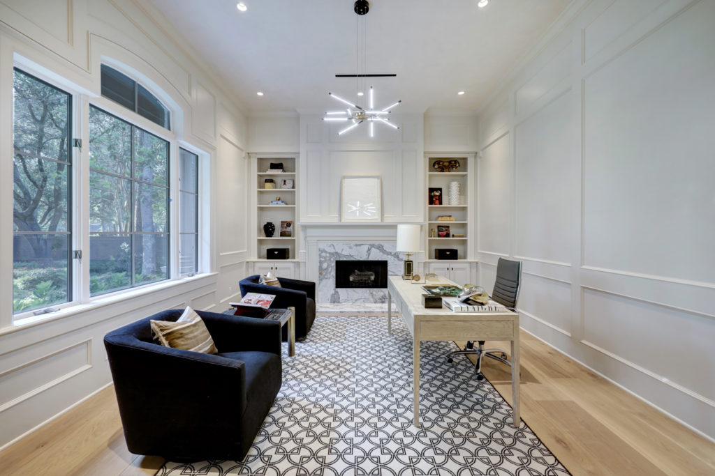 The study at 402 Timberwilde Lane has one of three fireplaces that grace the Memorial area manse. (Photo by TK Images)