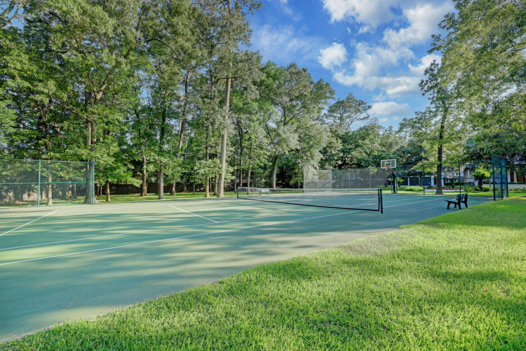 The 2.5 acre lot at 402 Timberwilde Lane includes a tennis court. (Photo by TK Images)