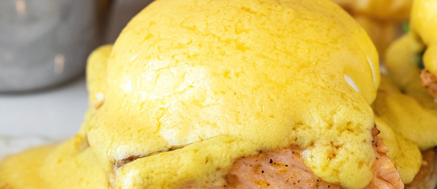 Toasted Yolk – Salmon and spinach Arnold with two poached eggs and hollandaise sauce