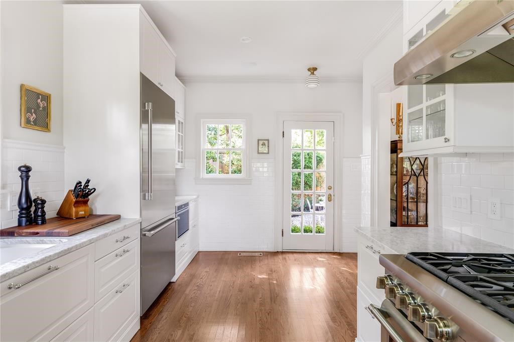 The kitchen is a stunning blank slate with high-end Thermador appliances. 