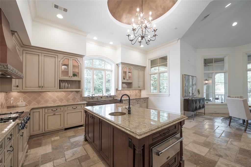 The kitchen boasts top-of-the-line amenities and appliances.