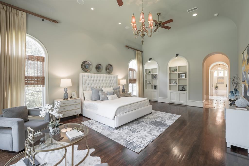 The secluded primary suite enjoys water views, a fitness studio and private laundry.