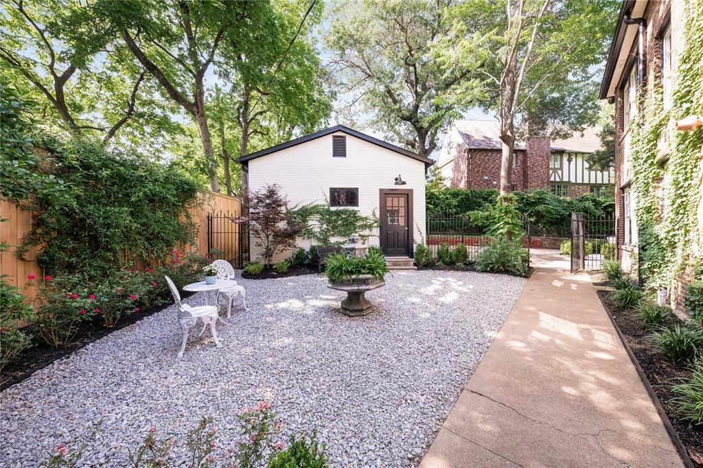 A shady courtyard and detached, two-car garage. 