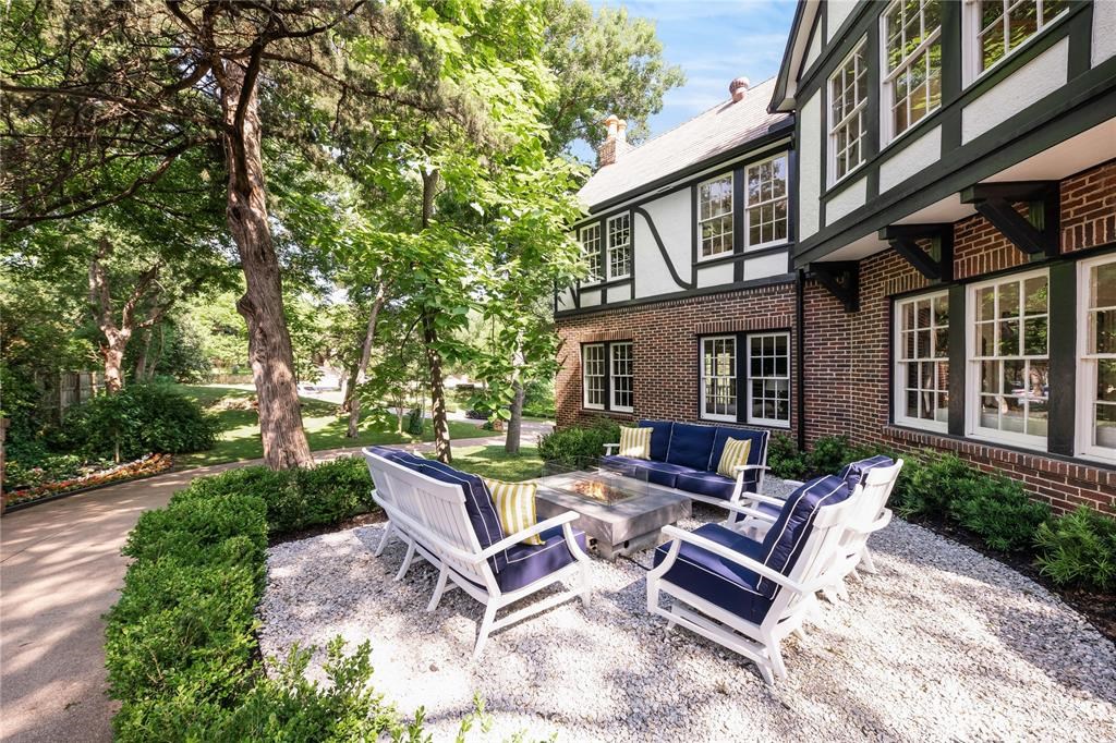 A towering Cedar tree shades the home's private patio. 