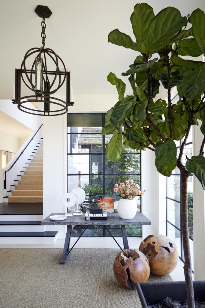 Along with architect Bill Ingram and landscape architect Gavin Duke, Kasler transformed this Nashville house into a casual and tailored hub for entertaining. The entry sets the stage with natural materials, a graphic palette, and strong but simple forms. (Photo by Melanie Acevedo)