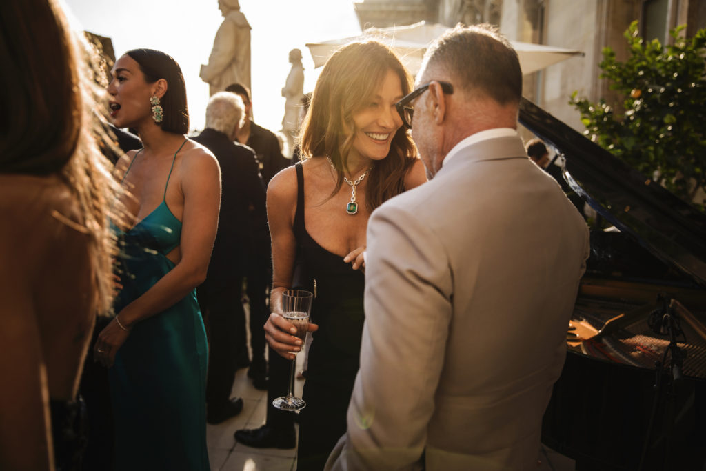 Carla Bruni at the Louvre dinner styling a David Yurman high jewelry Stax Lariat necklace in 18K white gold with diamonds and Colombian emerald  (Photo by Lewis Merritt)