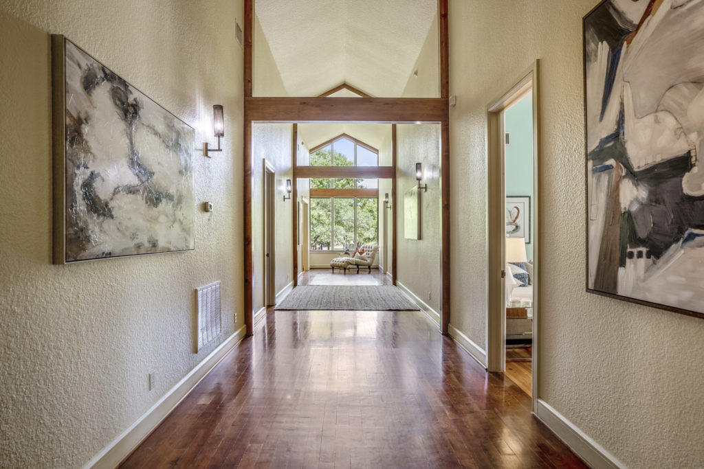 Hallways are designed for artwork at 405 W. Spreading Oaks Avenue in Friendswood, the mansion originally designed for power house attorney Tony Buzbee.
