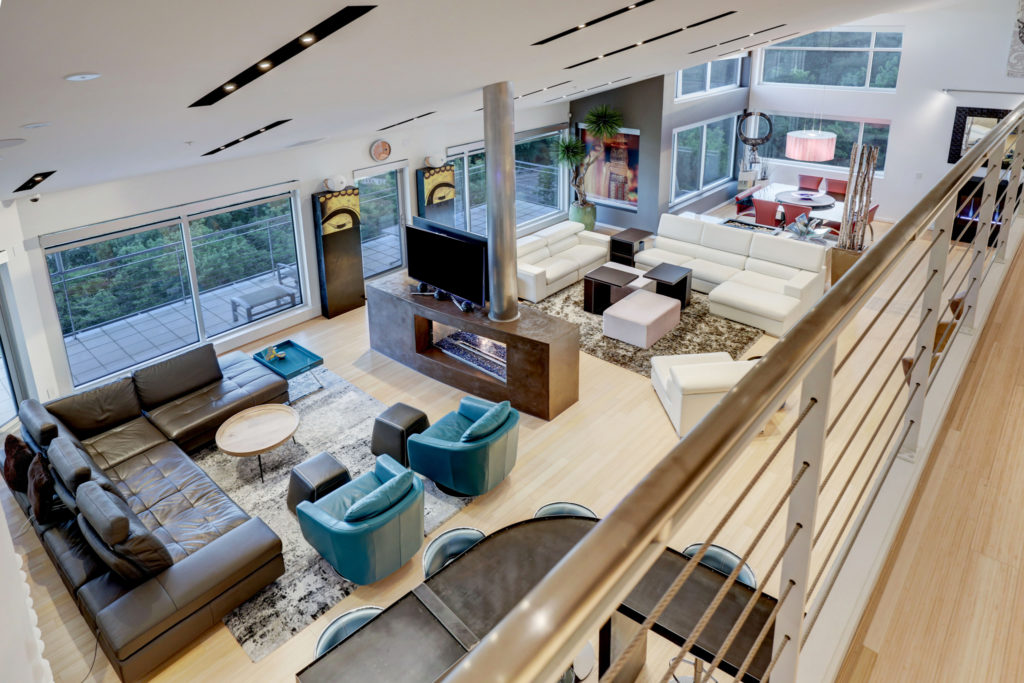 The penthouse at 102 Quitman features two-story living and kitchen/dining areas. (Photo by TK Images)