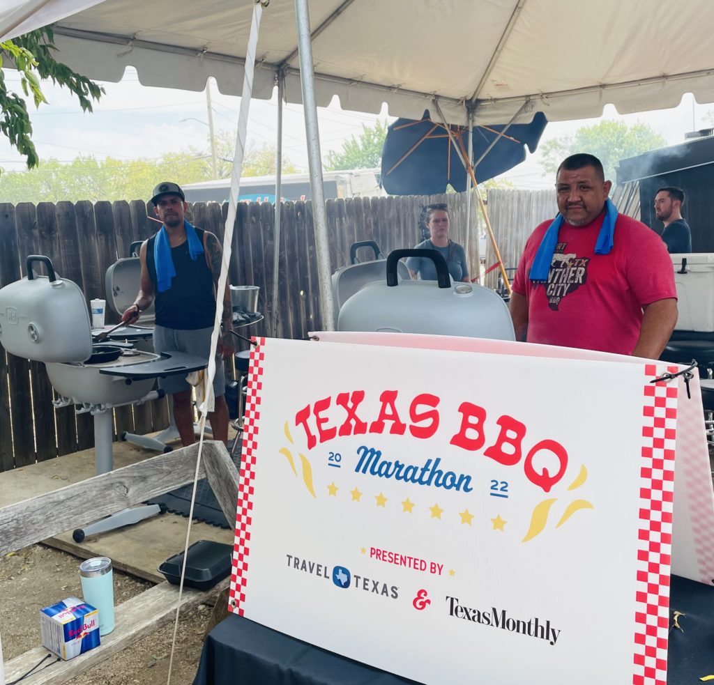 Pitmasters Chris Magallanes and Ernest Morales take on the Guinness Book grilling marathon. Photo by Courtney Dabney.