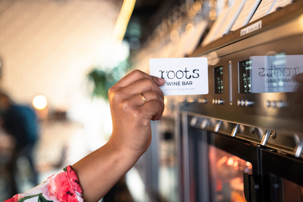 Every diner at Roots Wine Bar is issued a Roots Card that enables you to serve yourself a pour (1-, 3-, or 5-ounce one) of any wine on tap.  (Photo by Michael Anthony)
