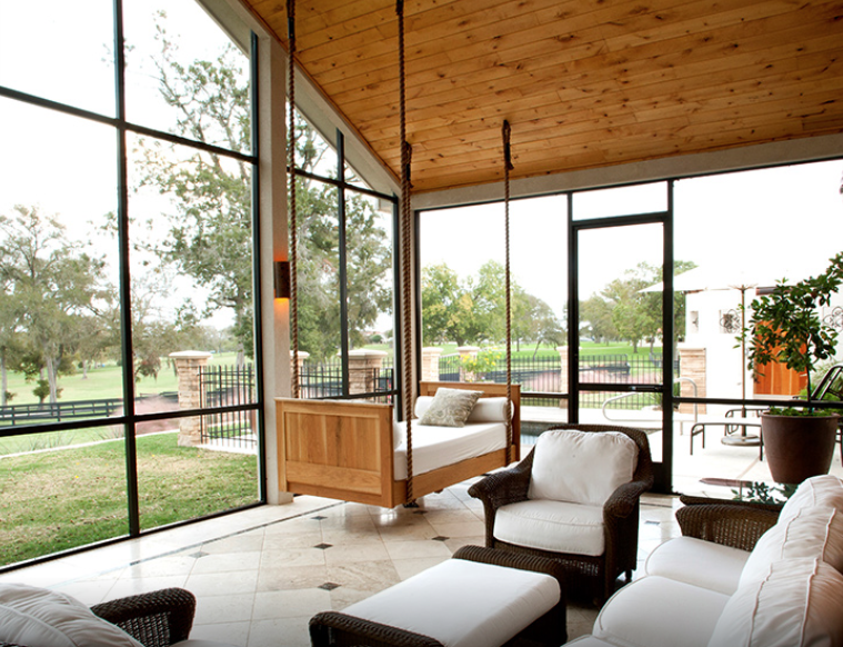 Each hacienda at the Inn at Dos Brisas has a fully furnished screened porch with a heavenly swing bed. (Photo by Julie Soefer)