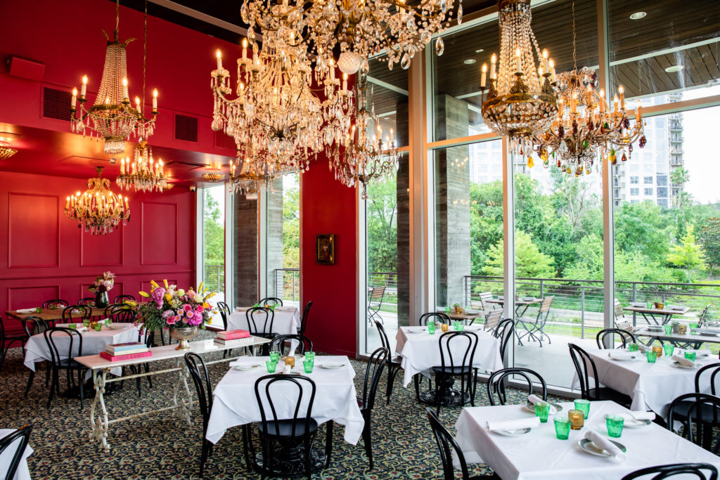 More than a dozen vintage chandeliers add overhead elegance to the Frida Private Room at Flora. (Photo by Kirsten Gilliam)