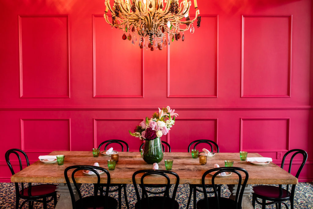 The vibrant red wall sets a lively tone for the Frida Private Room at Flora. (Photo by Kirsten Gilliam)