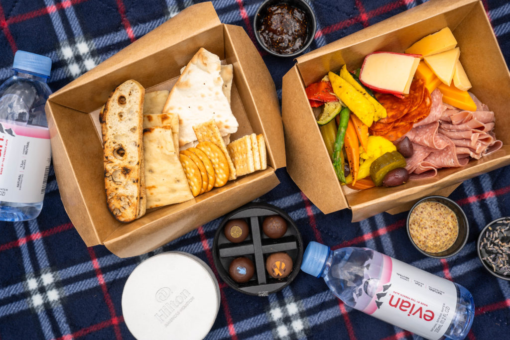 Pick up a to-go charcuterie board from Hilton Americas and have a picnic in the park before the summer up. (photo: Hilton Americas)