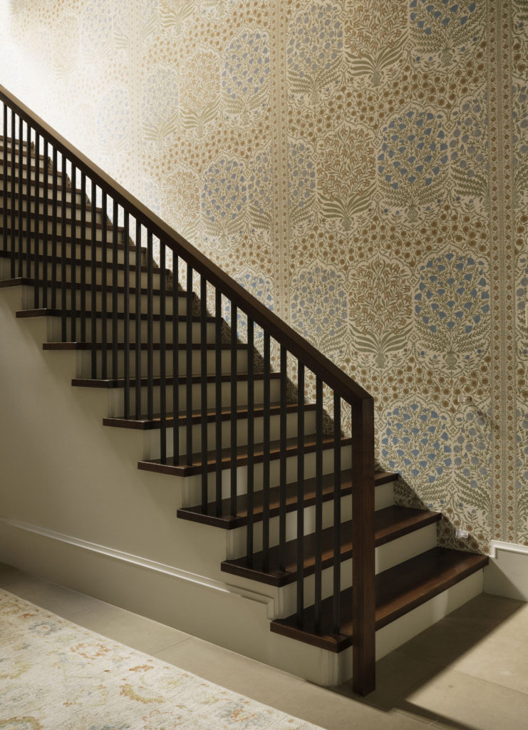 Lee Jofa, Sameera in Sapphire/Gold wallpaper in the stairwell of this West University home. (Photo by Jack Thompson)