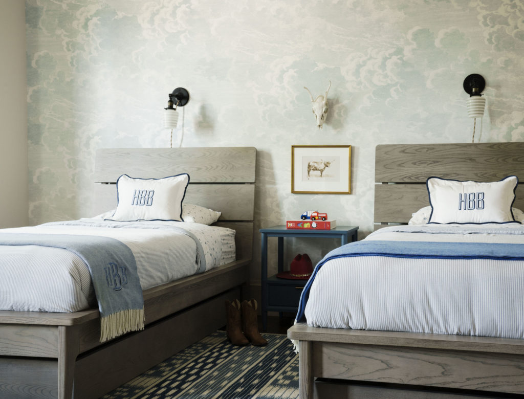 The boy's twin bedroom is papered with  Cole & Son's Nuvole Al Tramonto. Bedding is Pottery Barn Kids Chambray. (Photo by Jack Thompson)