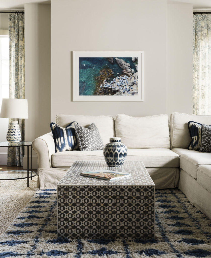 The Annie Selke area rug and Wisteria coffee table are focal point of the playroom. (Photo by Jack Thompson)