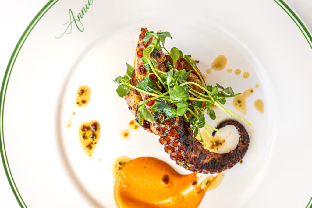 Chef Sutton created a wood-grilled octopus dish at The Annie with a Calabrian chile aioli and potato cake. (Photo by Jenn Duncan)