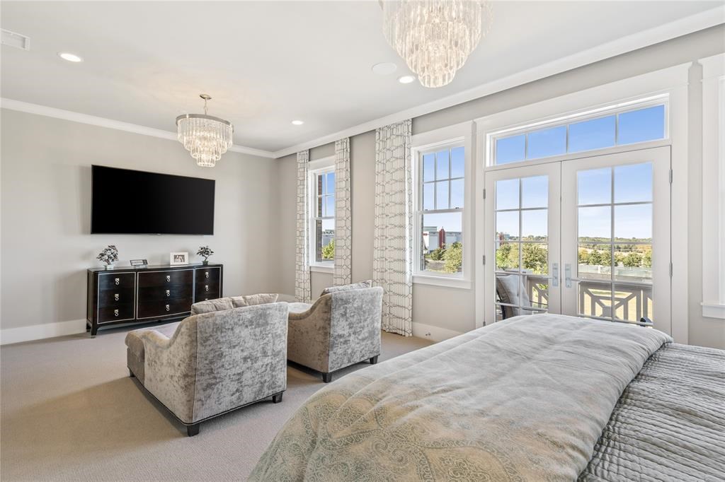 1543 Meeting Street – The spacious primary bedroom opens onto its own private balcony.