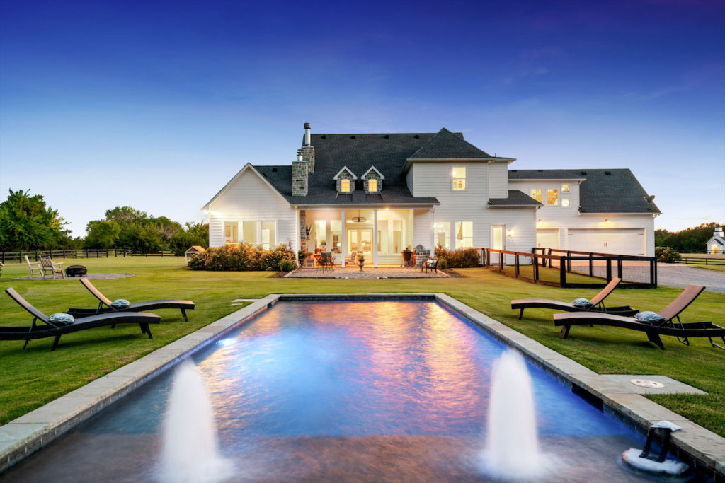 The streamlined pool adds a serene, modern touch. (Photo by Sharp Frame Media for Douglas Elliman Realty)