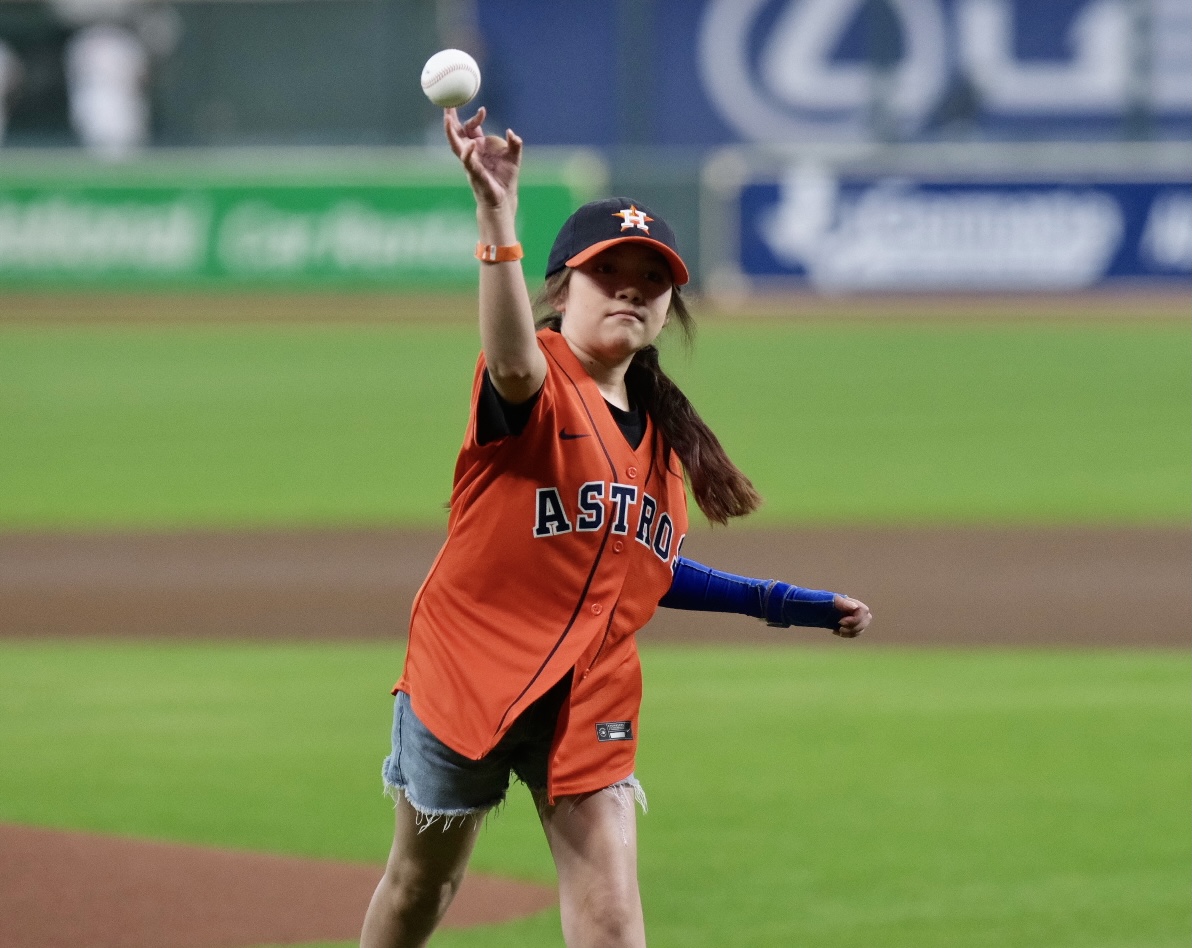 Courages Uvalde survivor Mayah Zamora got to throw out the first pitch with an Orbit and Mattress Mack escort. (Photo by F. Carter Smith)