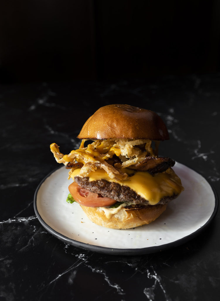 The mighty Bacon BBQ Burger awaits at the newly opened Craft Burger at Finn Hall downtown.  (Photo by Julie Soefer)