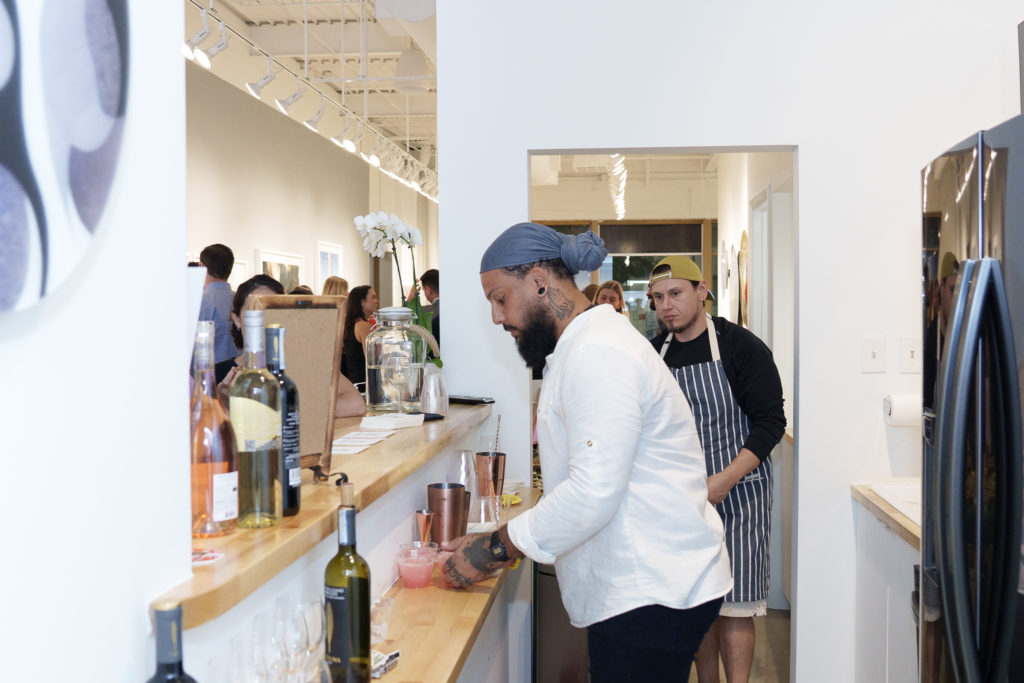 Bar tender Joseph Seahorn working his magic at Urban Harvest's Cultivators launch event at Christopher Martin Gallery.