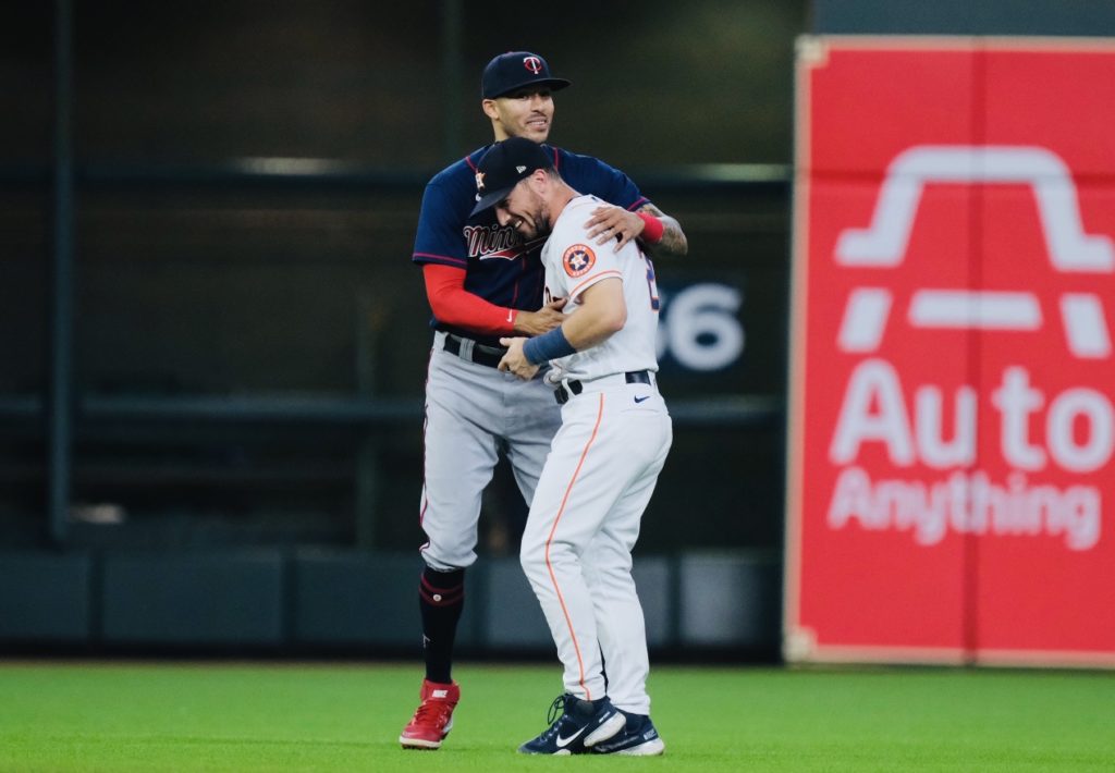 Carlos Correa gave Astros third baseman Alex Bregman a big hug. (Photo by F. Carter Smith)