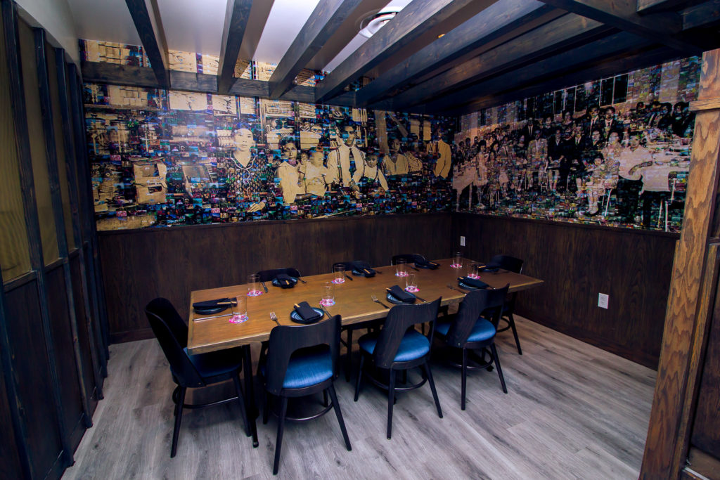 Part of the dining room at Pacha Nikkei features a mural created to highlight the Japanese immigrants who fled to Peru, like Chef Fukara's own family. (Photo by Marco Torres)