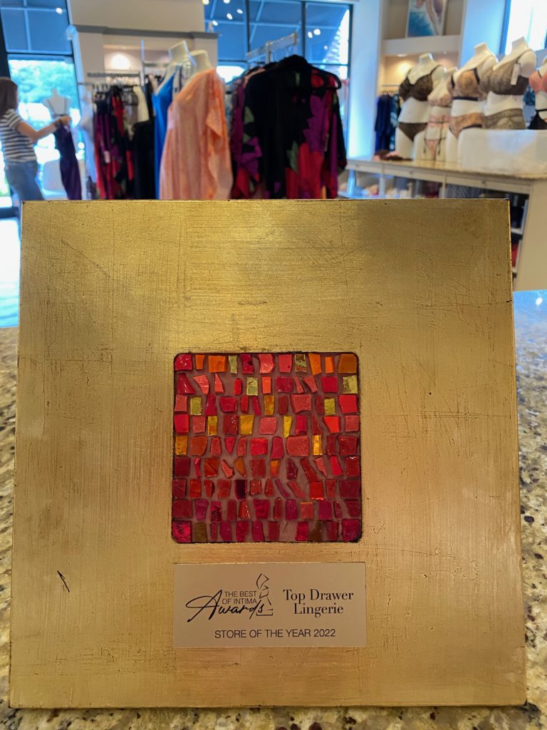 Top Drawer Lingerie's 2022 award on display in the store located in Houston's Uptown Park.
