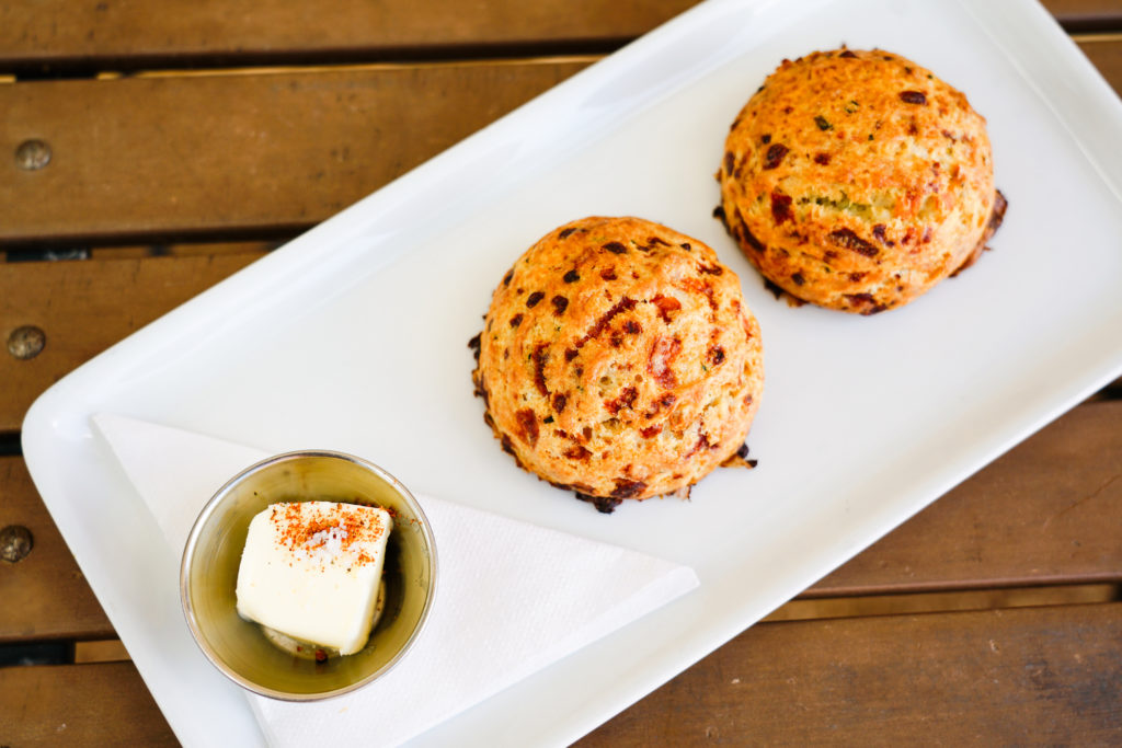 Housemade cheddar biscuits are served up at breakfast with whipped butter. (Photo by Mikah Danae)