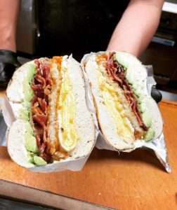 Shug’s Bagels – BLT bagel sandwich with avocado and egg.