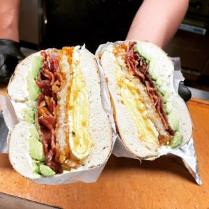Shug’s Bagels – BLT bagel sandwich with avocado and egg.