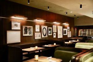 The interior of the new Houston Il Bracco features art from Alex Katz, Lucien Freud, and Richard Serra, among others. (Photo courtesy of il Bracco)