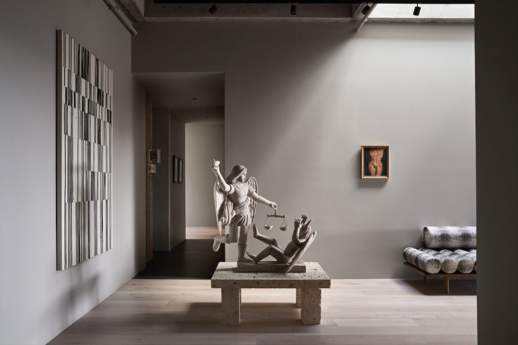 Natural light washes across the penthouse’s main gallery, illuminating a stone sculpture and nude painting acquired by clients Diane and Ray Krueger while traveling in Prague. Robert Kelly’s Thicket Assemblage, 2006, from Barbara Davis Gallery, Houston. (Photo by Pär Bengtsson)