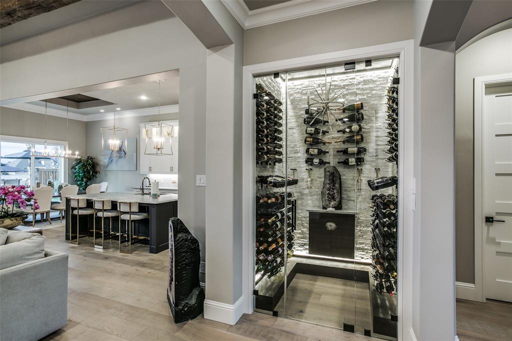 Glass fronted wine cave just off the open living and dining spaces.