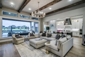 6025 Lakeside – Spacious living and kitchen will a view to the water beyond.